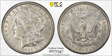 1892-O $1 VAM 5(7), Doubled Ear AU50